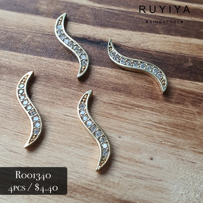 GOLD S-WAVE CRYSTAL CHARM R001340