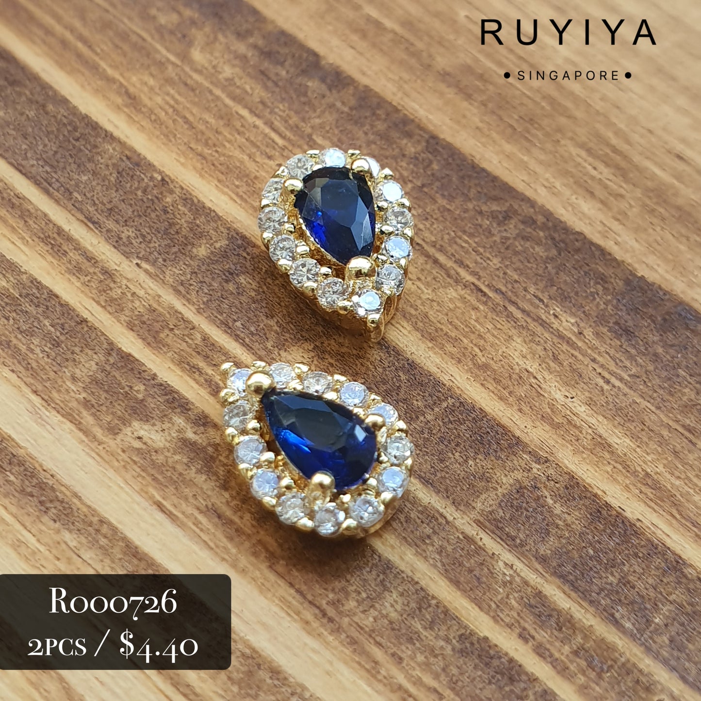 GOLD SMALL TEAR DROP CRYSTAL CHARM (BLUE) R000726