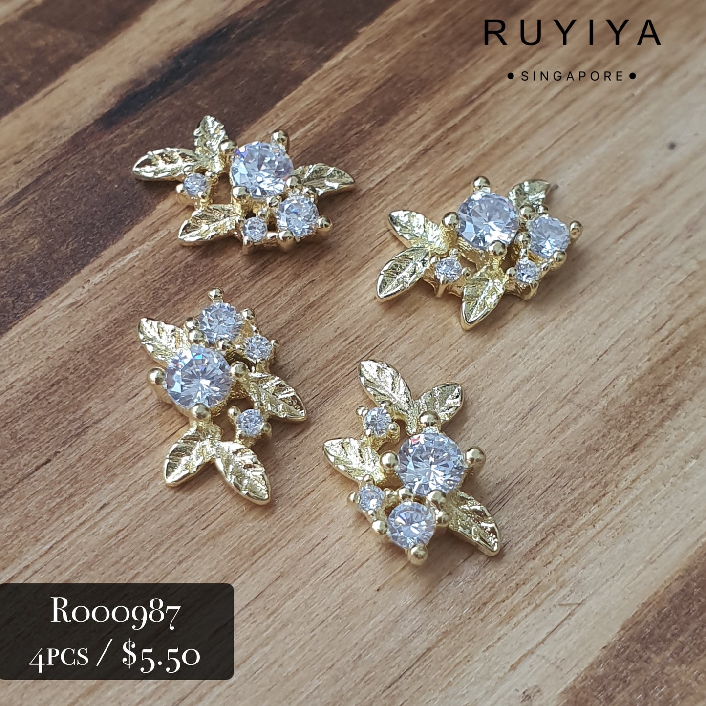 GOLD LEAVES WITH CRYSTAL CHARM R000987