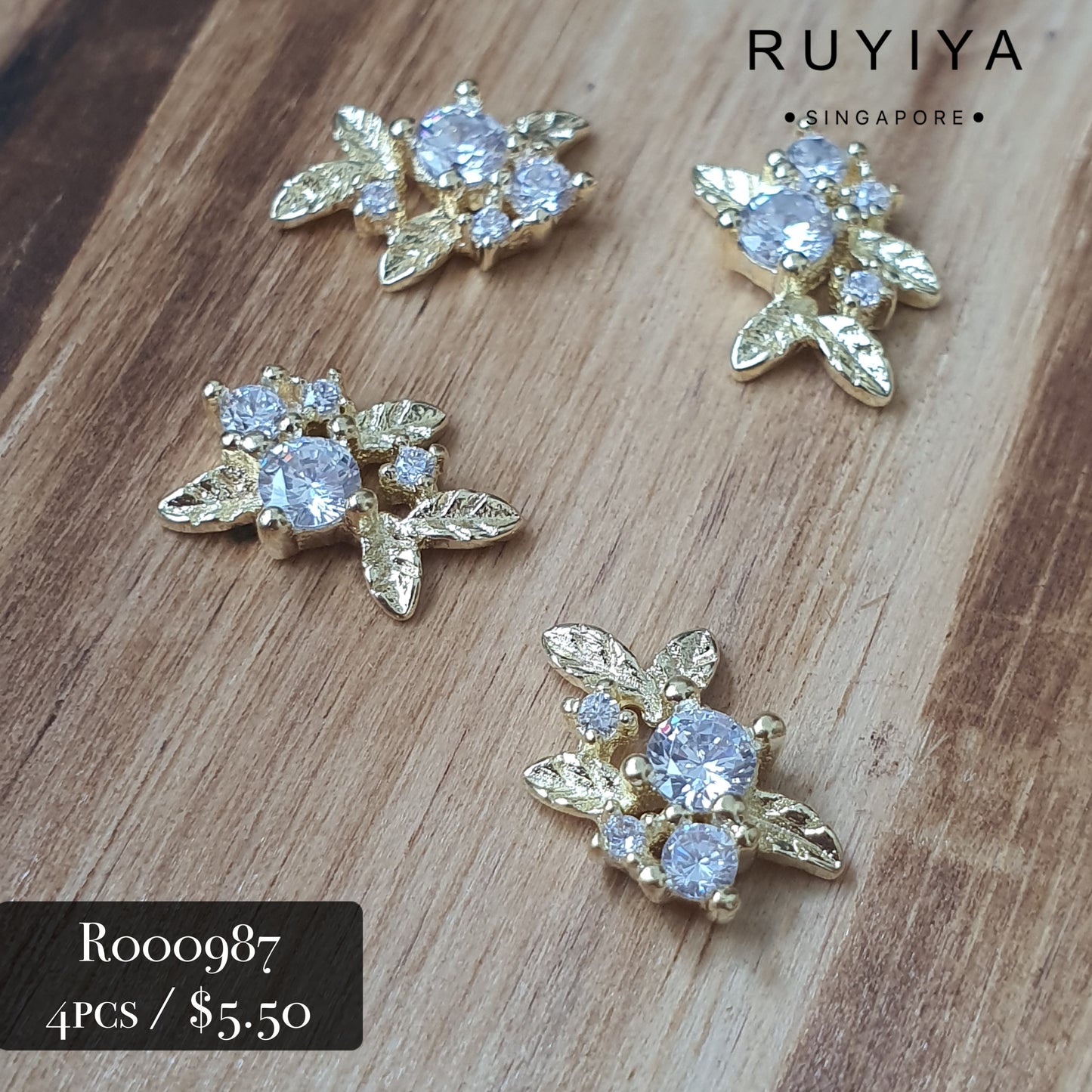 GOLD LEAVES WITH CRYSTAL CHARM R000987