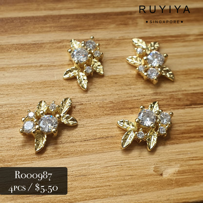GOLD LEAVES WITH CRYSTAL CHARM R000987